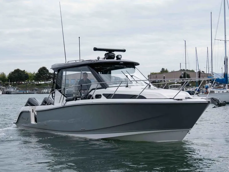 Slide: The Image of Boston Whaler 325 Conquest 2026 on calm waters. - 4