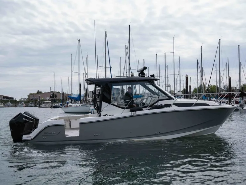 Slide: The Image of 2026 Boston Whaler 325 Conquest in harbor, side view. - 5