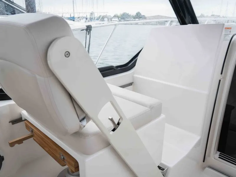 Slide: The Image of Interior of 2026 Boston Whaler 325 Conquest with luxurious seating. - 7
