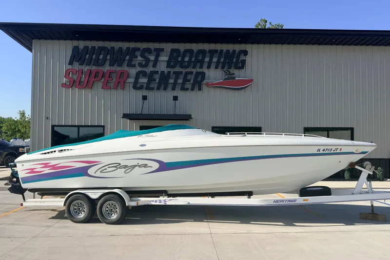 The Image of 1999 Baja 29 Outlaw boat on trailer at Midwest Boating Super Center. - 1
