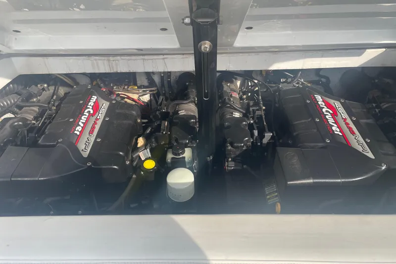 Slide: The Image of 1999 Baja 29 Outlaw boat engine compartment with twin MerCruiser 454 Magnum MPI engines. - 28