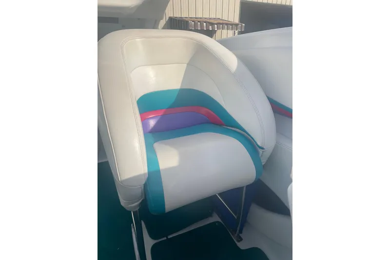 Slide: The Image of 1999 Baja 29 Outlaw boat seat with colorful upholstery design. - 33