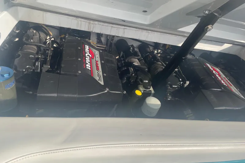 Slide: The Image of 1999 Baja 29 Outlaw boat engine compartment with twin MerCruiser 454 Mag MPI engines. - 34