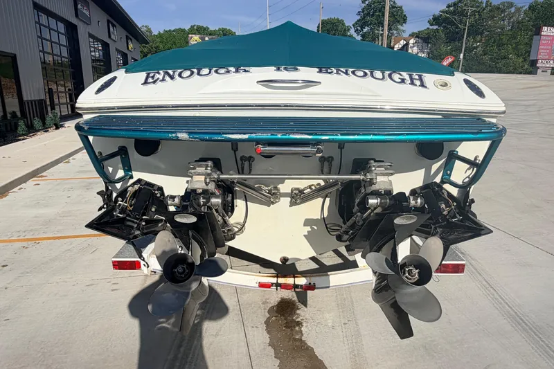 Slide: The Image of Rear view of a 1999 Baja 29 Outlaw boat with dual propellers. - 4