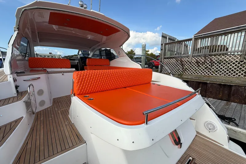 Slide: The Image of 2016 Azimut Atlantis 43 yacht with vibrant orange seating and sleek design. - 12
