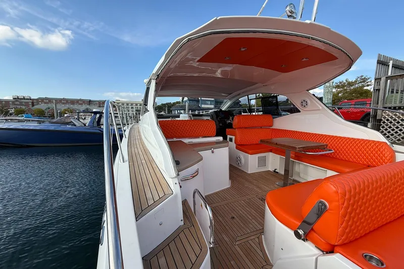 Slide: The Image of Luxurious 2016 Azimut Atlantis 43 yacht with vibrant orange seating and sleek design. - 13