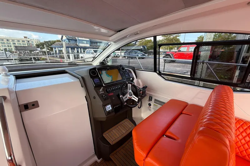 Slide: The Image of Interior of 2016 Azimut Atlantis 43 yacht with orange seating and modern navigation system. - 19