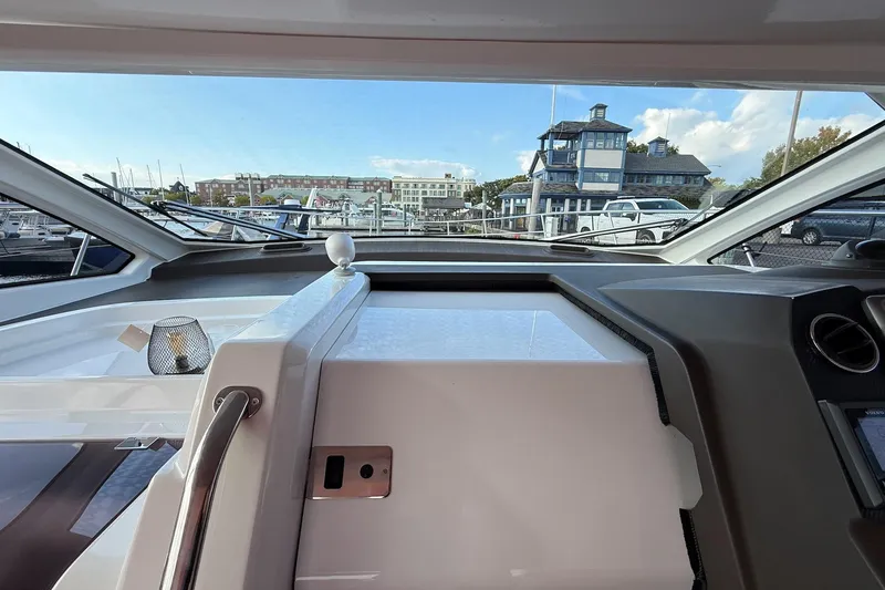 Slide: The Image of Interior view of 2016 Azimut Atlantis 43 yacht cockpit with marina background. - 22