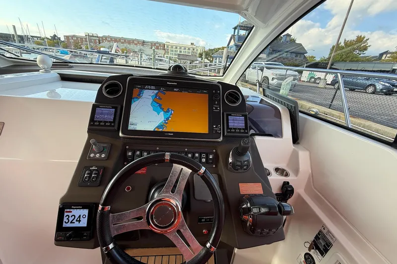 Slide: The Image of Helm of 2016 Azimut Atlantis 43 yacht with navigation display and controls. - 23