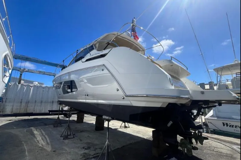 Slide: The Image of 2020 Azimut Atlantis 43 yacht on dry dock under clear blue sky. - 9