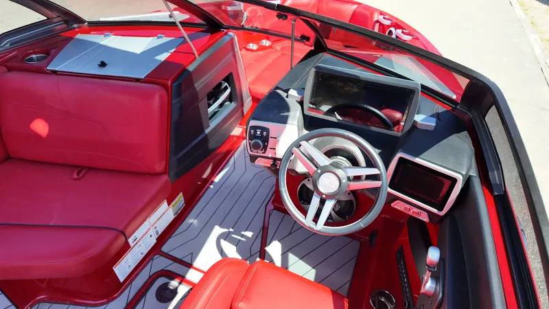 Slide: The Image of Interior of a 2019 Malibu Wakesetter 22 LSV with red upholstery. - 13