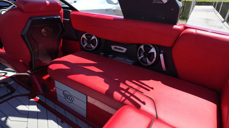 Slide: The Image of Red interior of 2019 Malibu Wakesetter 22 LSV with speakers. - 18