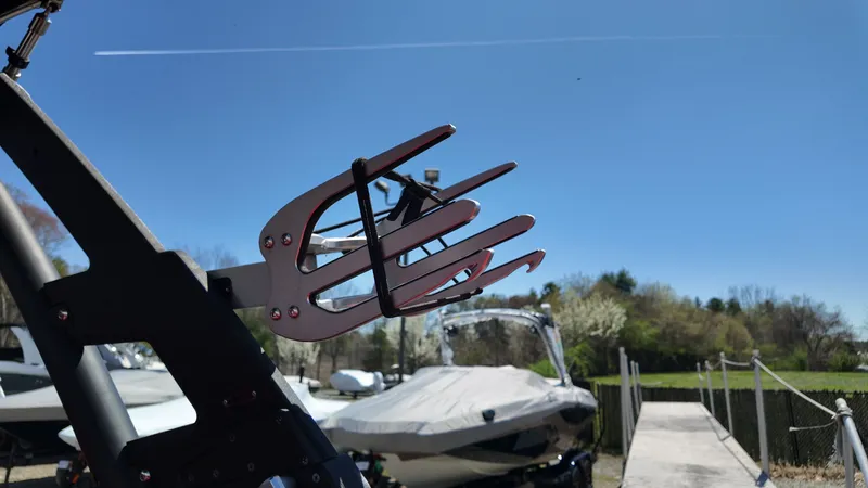 Slide: The Image of 2019 Malibu Wakesetter 22 LSV with wakeboard rack outdoors. - 19