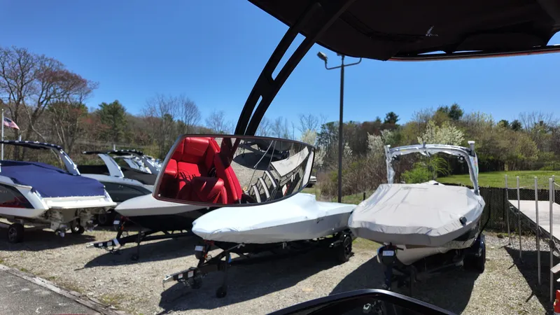 Slide: The Image of 2019 Malibu Wakesetter 22 LSV boats parked outdoors. - 22