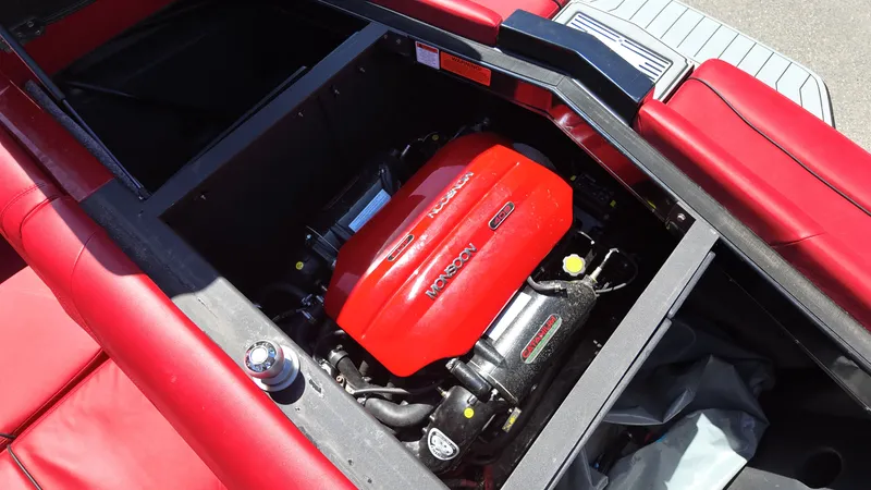 Slide: The Image of Engine compartment of 2019 Malibu Wakesetter 22 LSV with red engine. - 23