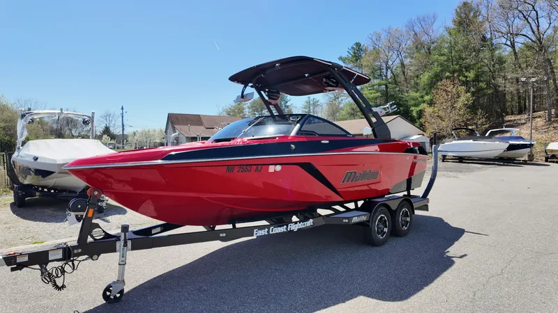 Slide: The Image of 2019 Malibu Wakesetter 22 LSV boat on trailer outdoors. - 3