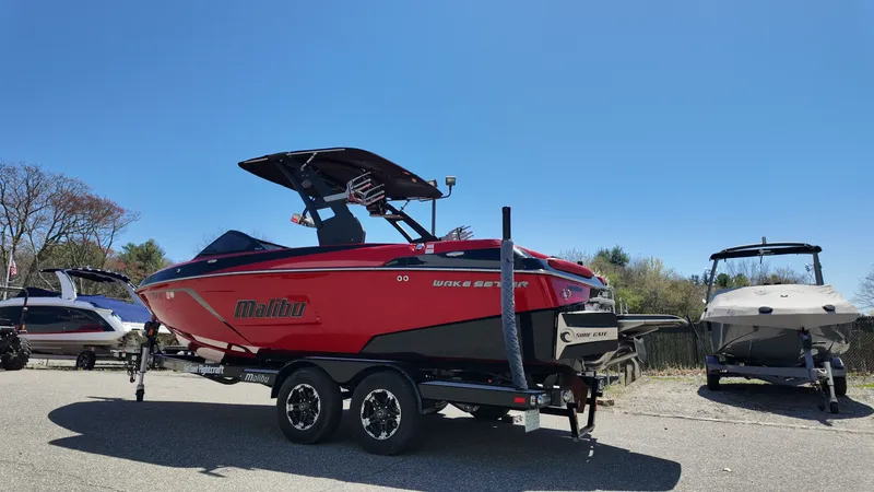 Slide: The Image of 2019 Malibu Wakesetter 22 LSV boat on trailer in sunny weather. - 4
