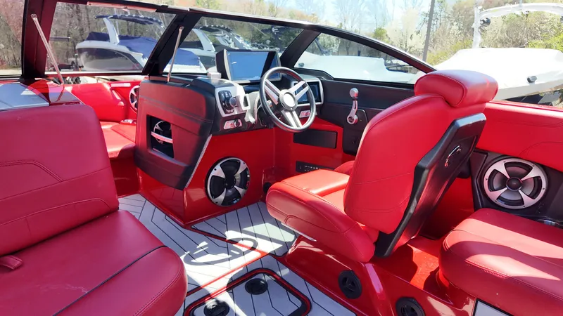 Slide: The Image of Interior of 2019 Malibu Wakesetter 22 LSV with red leather seats. - 8