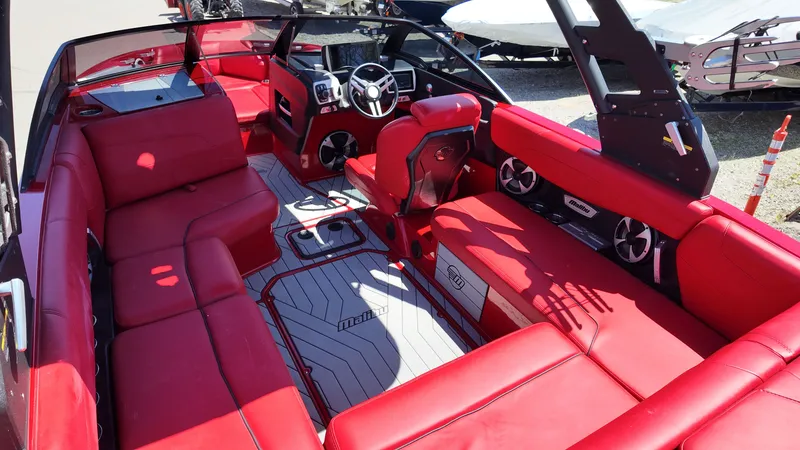 Slide: The Image of Interior of a 2019 Malibu Wakesetter 22 LSV with red seating. - 9