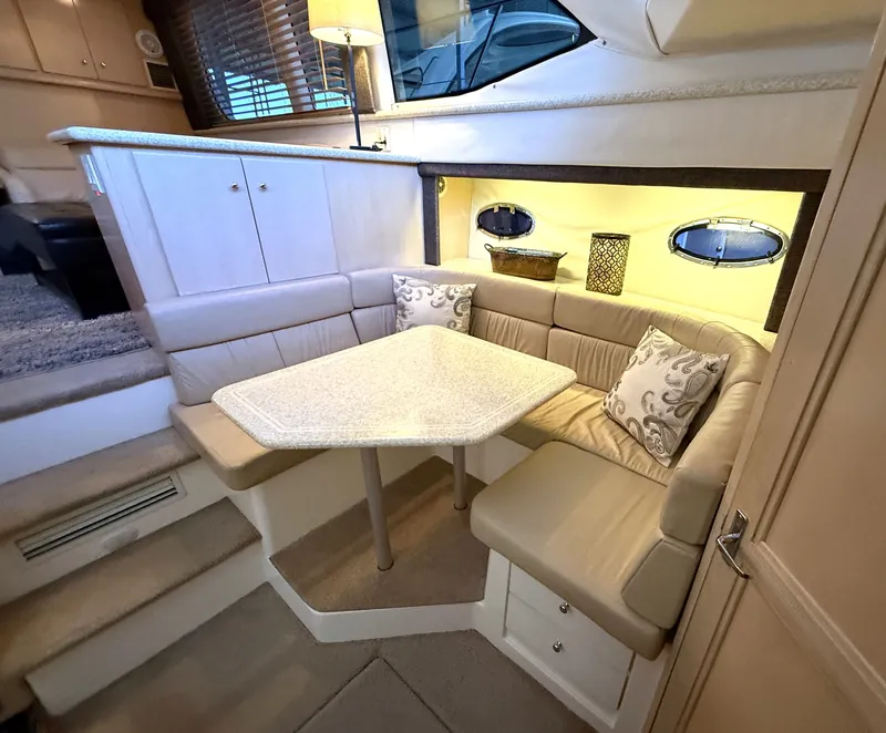 Slide: The Image of Interior of a 1999 Carver 406 yacht with leather sofa and carpet. - 16