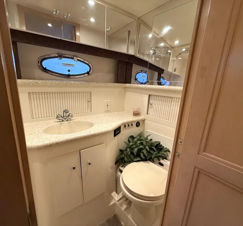 Slide: The Image of Interior of a 1999 Carver 406 yacht with carpet and kitchenette. - 19