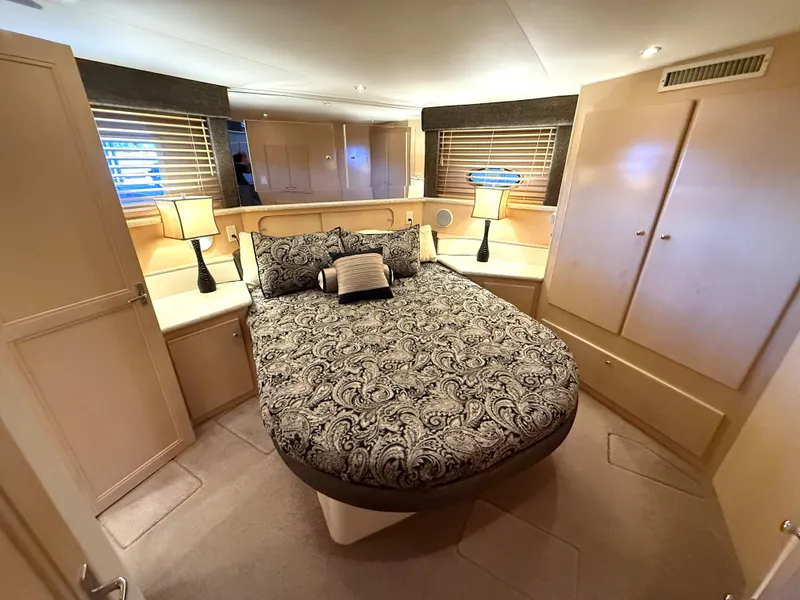 Slide: The Image of Interior of a 1999 Carver 406 yacht with cozy seating area. - 21