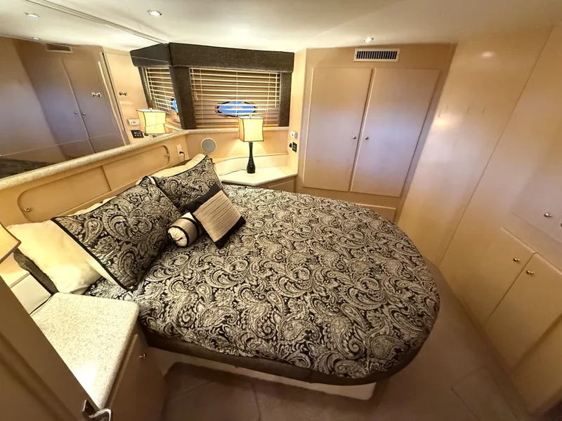 Slide: The Image of Interior of a 1999 Carver 406 yacht with cozy seating area. - 22