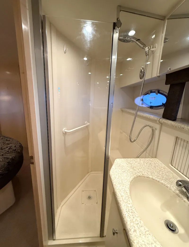 Slide: The Image of Luxurious bedroom in a 1999 Carver 406 yacht model. - 23