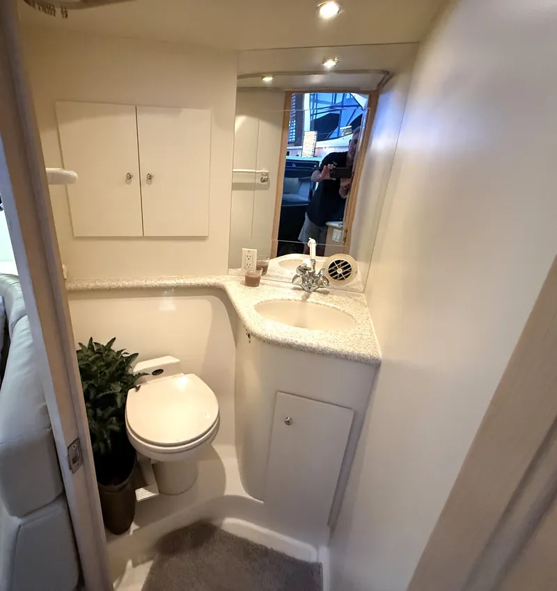Slide: The Image of Interior view of a 1999 Carver 406 bathroom with sink and toilet. - 29