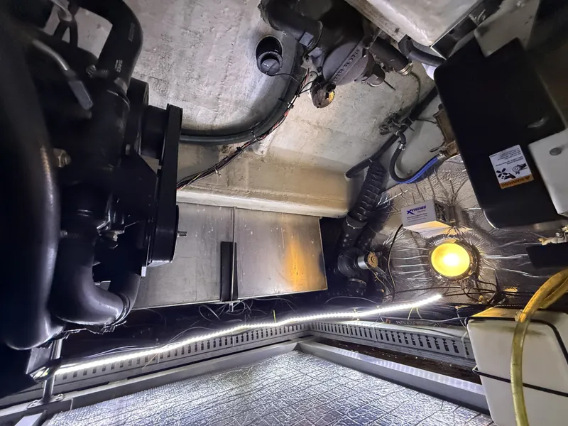 Slide: The Image of Engine room of a 1999 Carver 406 with lighting and cables. - 33