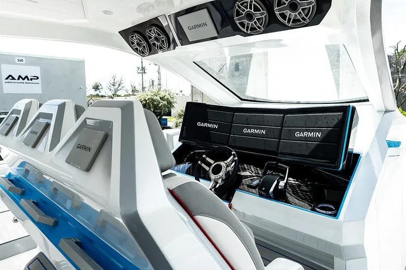 Slide: The Image of Interior of 2026 AMP 433 boat with Garmin navigation displays and modern steering console. - 10