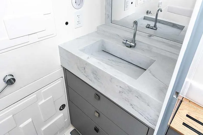 Slide: The Image of Modern bathroom sink with marble countertop in AMP 433, 2026 model. - 19