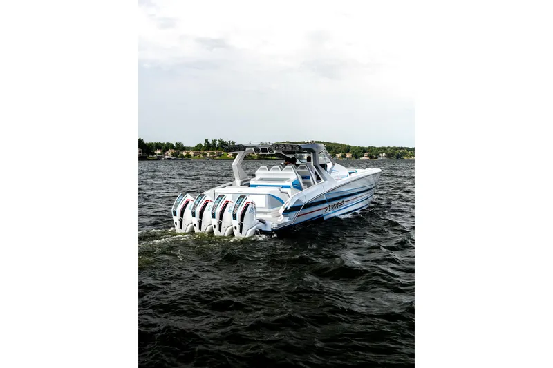Slide: The Image of High-performance AMP 433 boat cruising on a lake, 2026 model. - 6