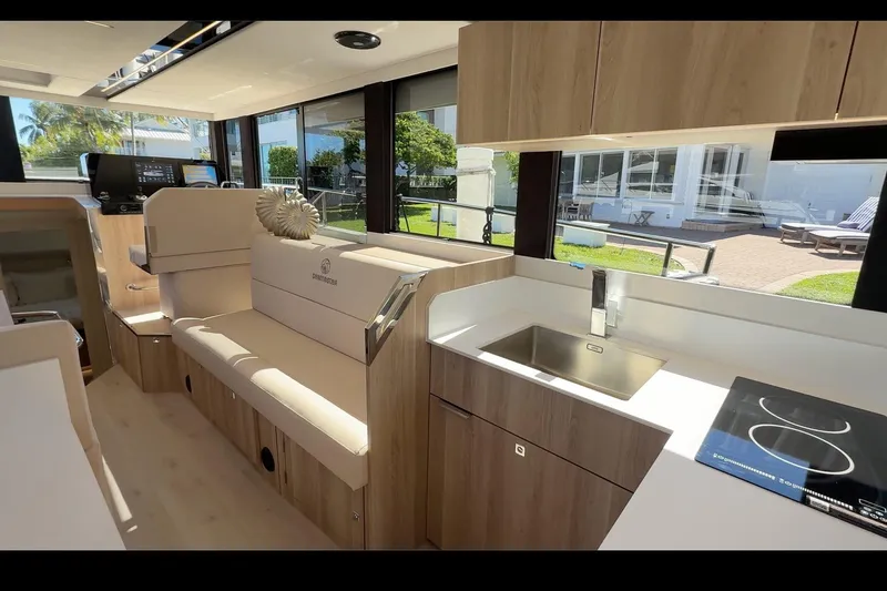 Slide: The Image of Modern interior of 2026 Cobra Yachts Seamaster 45, featuring sleek kitchen and seating area. - 14