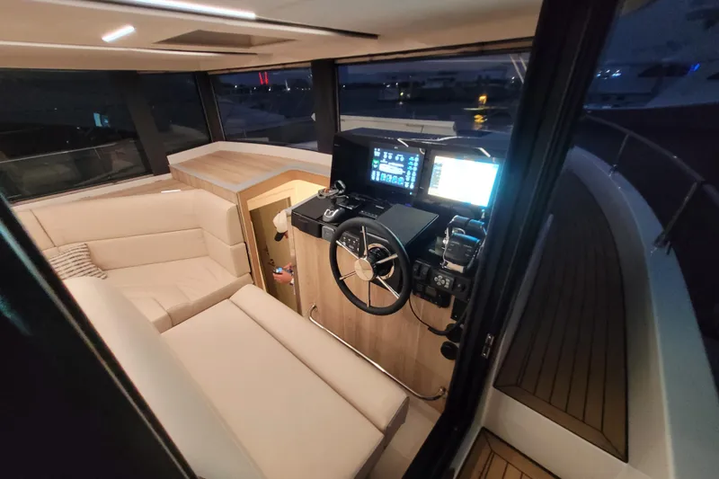 Slide: The Image of Interior of 2026 Cobra Yachts Seamaster 45, featuring modern helm and luxurious seating. - 15