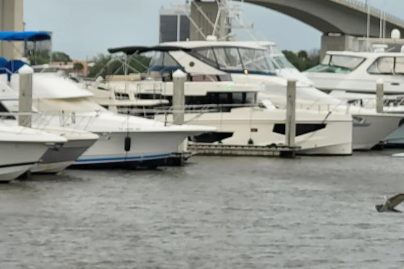 Slide: The Image of Boats docked at a marina, featuring a 2026 Cobra Yachts Seamaster 45. - 20