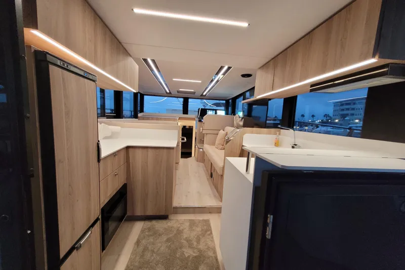 Slide: The Image of Modern interior of 2026 Cobra Yachts Seamaster 45, featuring sleek wood finishes and ambient lighting. - 22