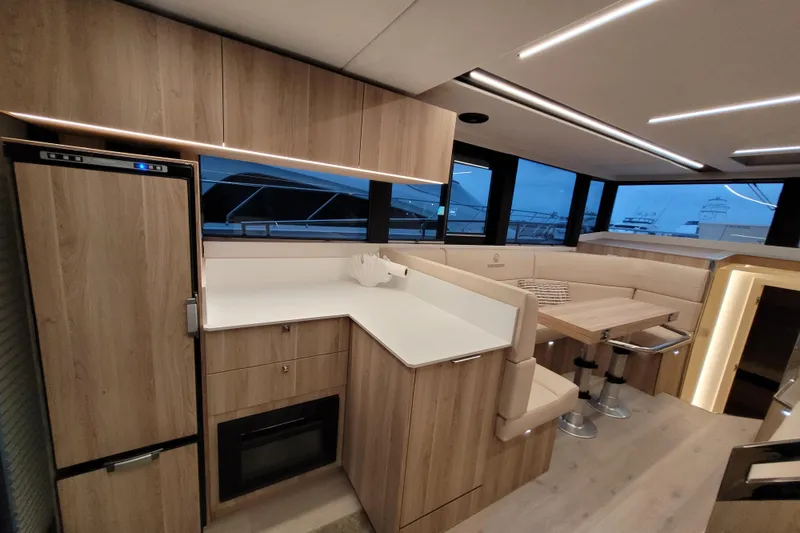 Slide: The Image of Luxurious interior of 2026 Cobra Yachts Seamaster 45 with modern kitchen and dining area. - 23