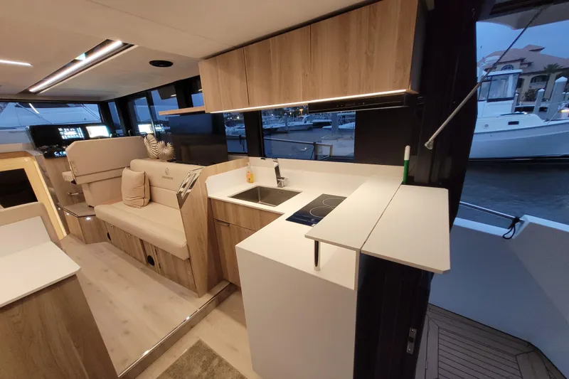 Slide: The Image of Modern interior of 2026 Cobra Yachts Seamaster 45, featuring sleek kitchen and seating area. - 24