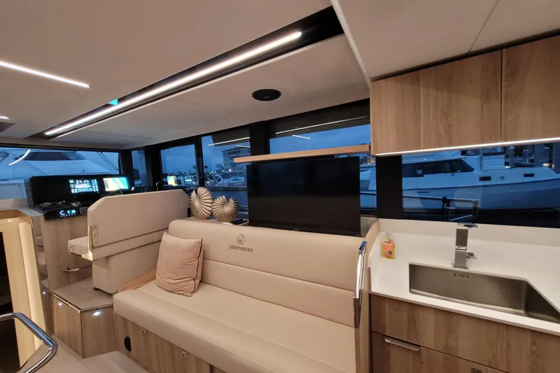 Slide: The Image of Luxurious interior of 2026 Cobra Yachts Seamaster 45 with modern seating and kitchen area. - 25