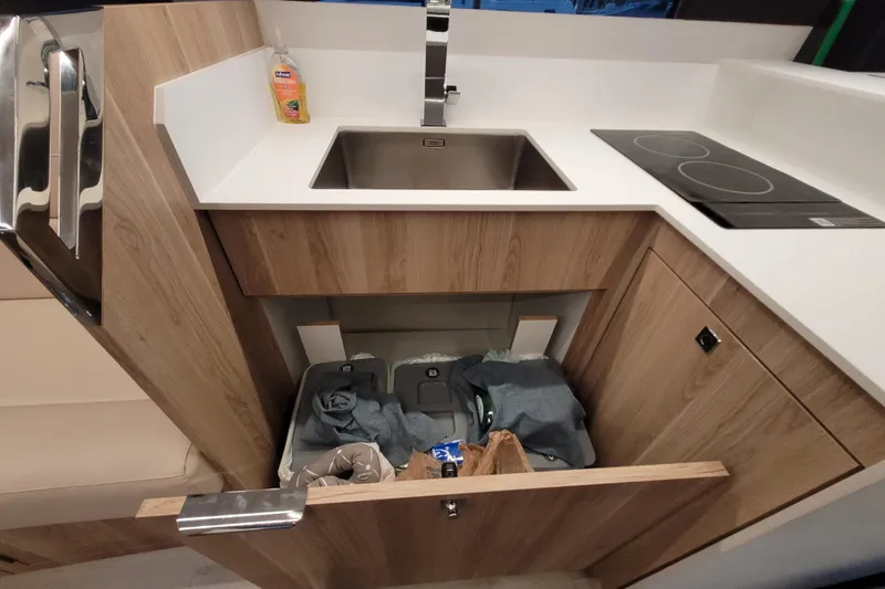 Slide: The Image of Modern kitchen area in 2026 Cobra Yachts Seamaster 45, featuring sink and induction cooktop. - 29