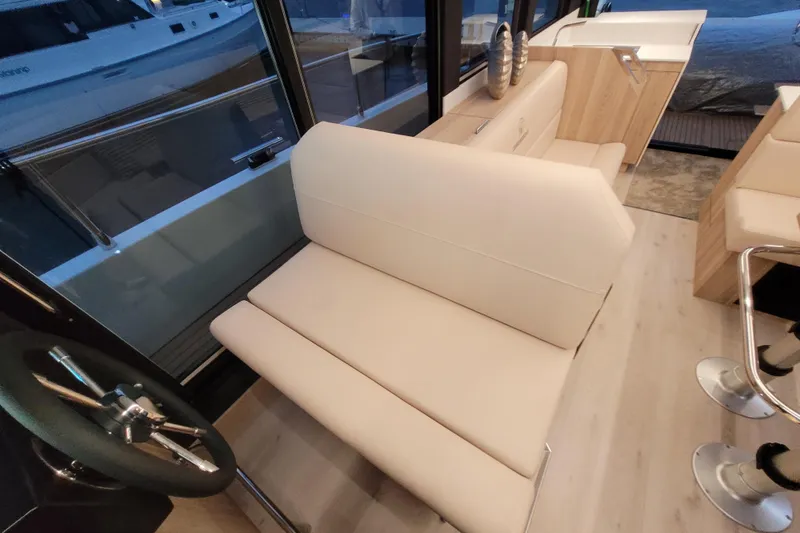 Slide: The Image of Interior of 2026 Cobra Yachts Seamaster 45, featuring beige seating and modern design. - 36