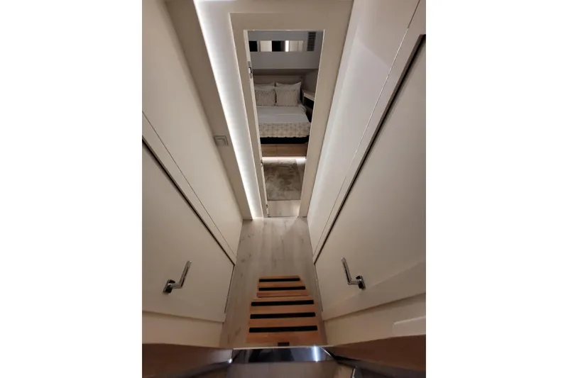 Slide: The Image of Interior view of 2026 Cobra Yachts Seamaster 45, featuring a modern hallway and cozy bedroom. - 39