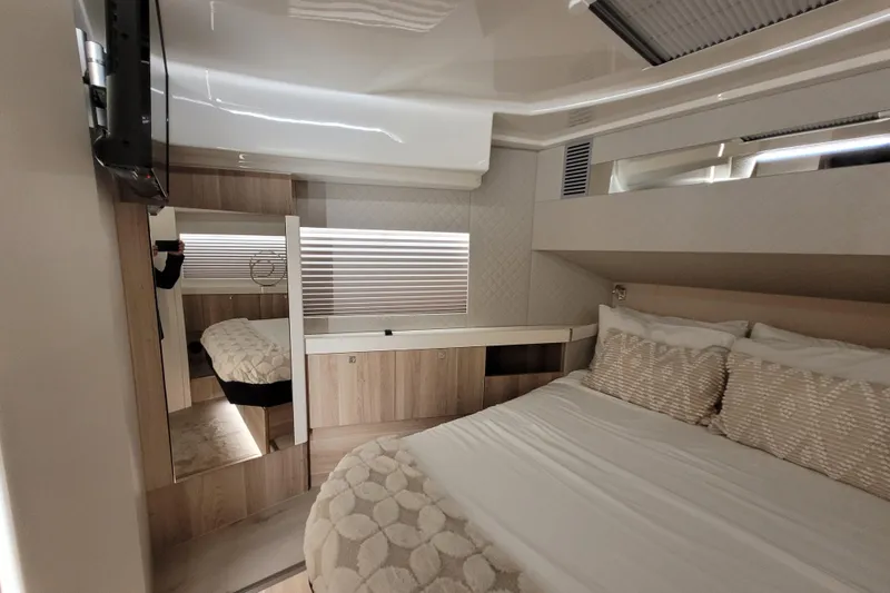 Slide: The Image of Luxurious interior cabin of 2026 Cobra Yachts Seamaster 45 with modern design and cozy bedding. - 44