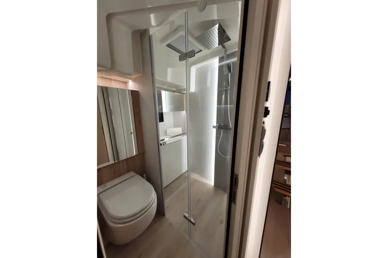 Slide: The Image of Modern bathroom interior of 2026 Cobra Yachts Seamaster 45, featuring sleek shower and toilet. - 51