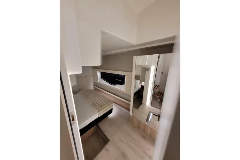 Slide: The Image of Luxurious interior cabin of 2026 Cobra Yachts Seamaster 45, featuring modern design and cozy bedding. - 52