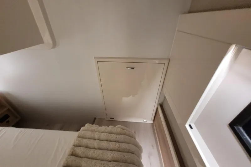 Slide: The Image of Interior of 2026 Cobra Yachts Seamaster 45, featuring a cozy cabin space with modern design. - 55