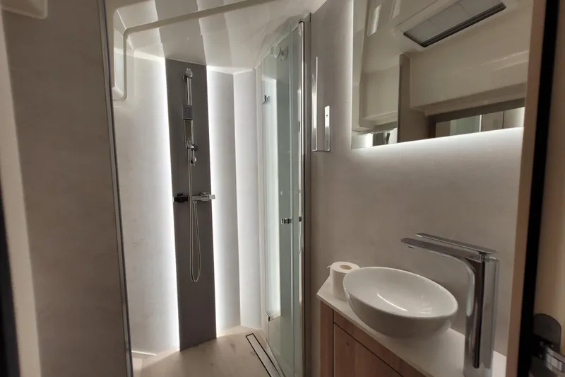 Slide: The Image of Modern bathroom interior of 2026 Cobra Yachts Seamaster 45, featuring sleek shower and basin. - 61