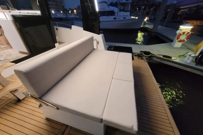 Slide: The Image of Luxurious seating on 2026 Cobra Yachts Seamaster 45, docked at night. - 69