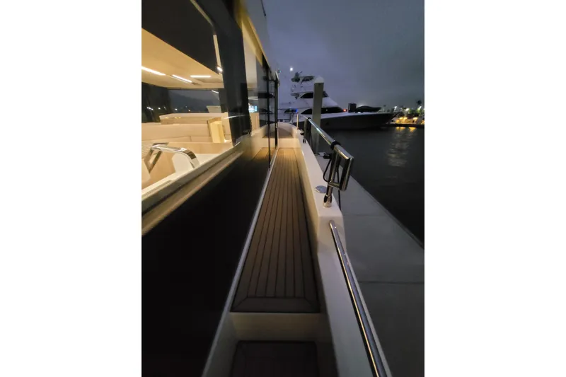Slide: The Image of 2026 Cobra Yachts Seamaster 45 deck at night, featuring sleek design and ambient lighting. - 71